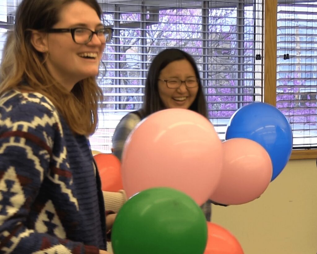 Friends enjoying a balloon-filled celebration