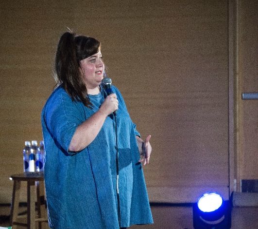 Stand-up comedy show with spotlight ambiance
