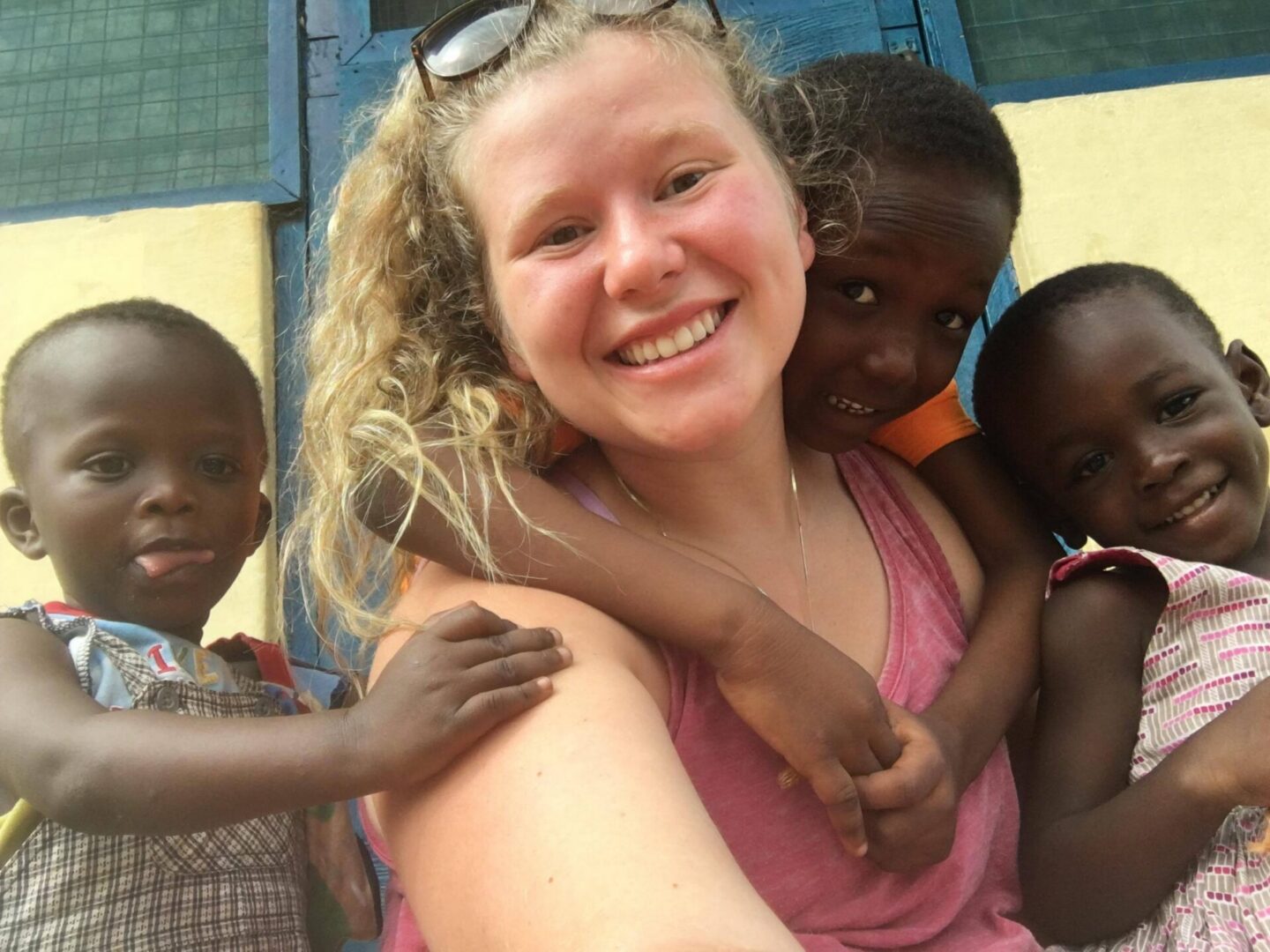 Smiling group selfie with three children