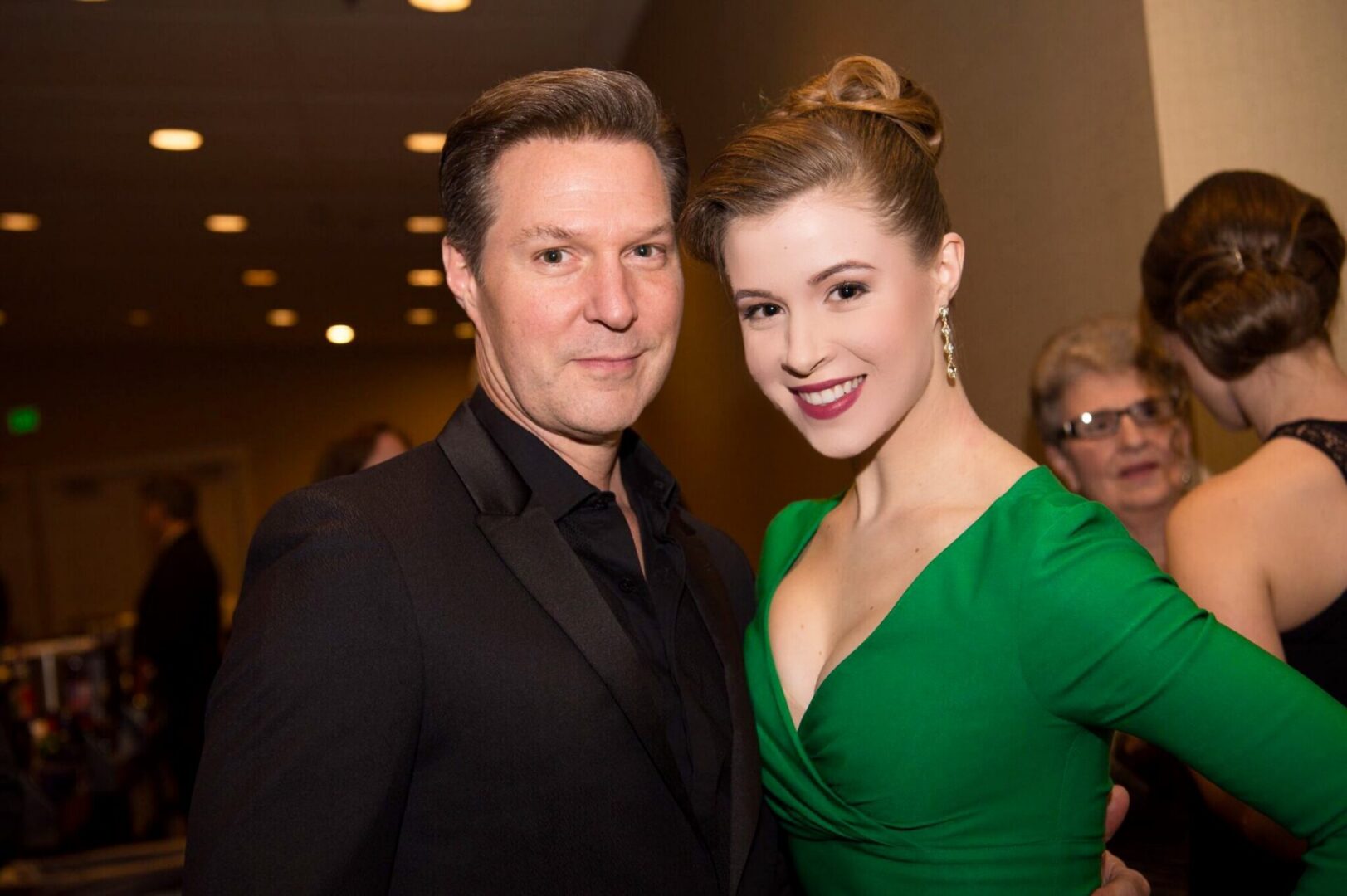 Elegant couple posing at a party