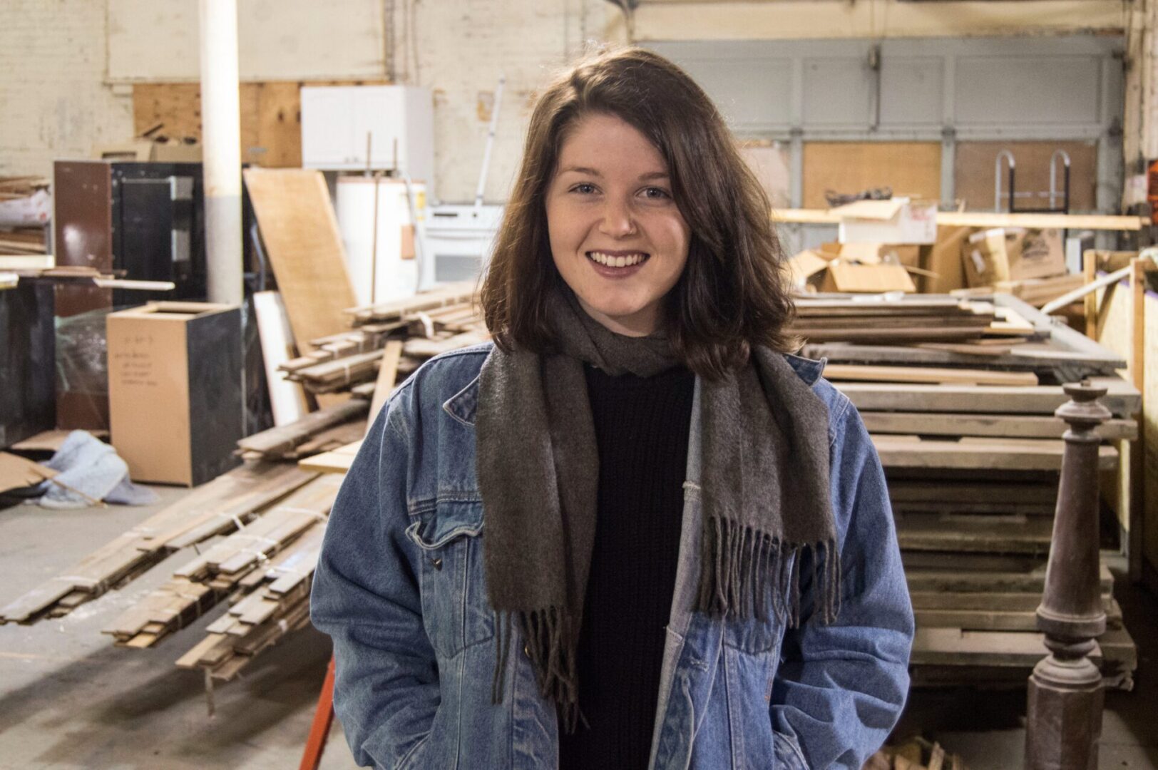Woman smiling in warehouse