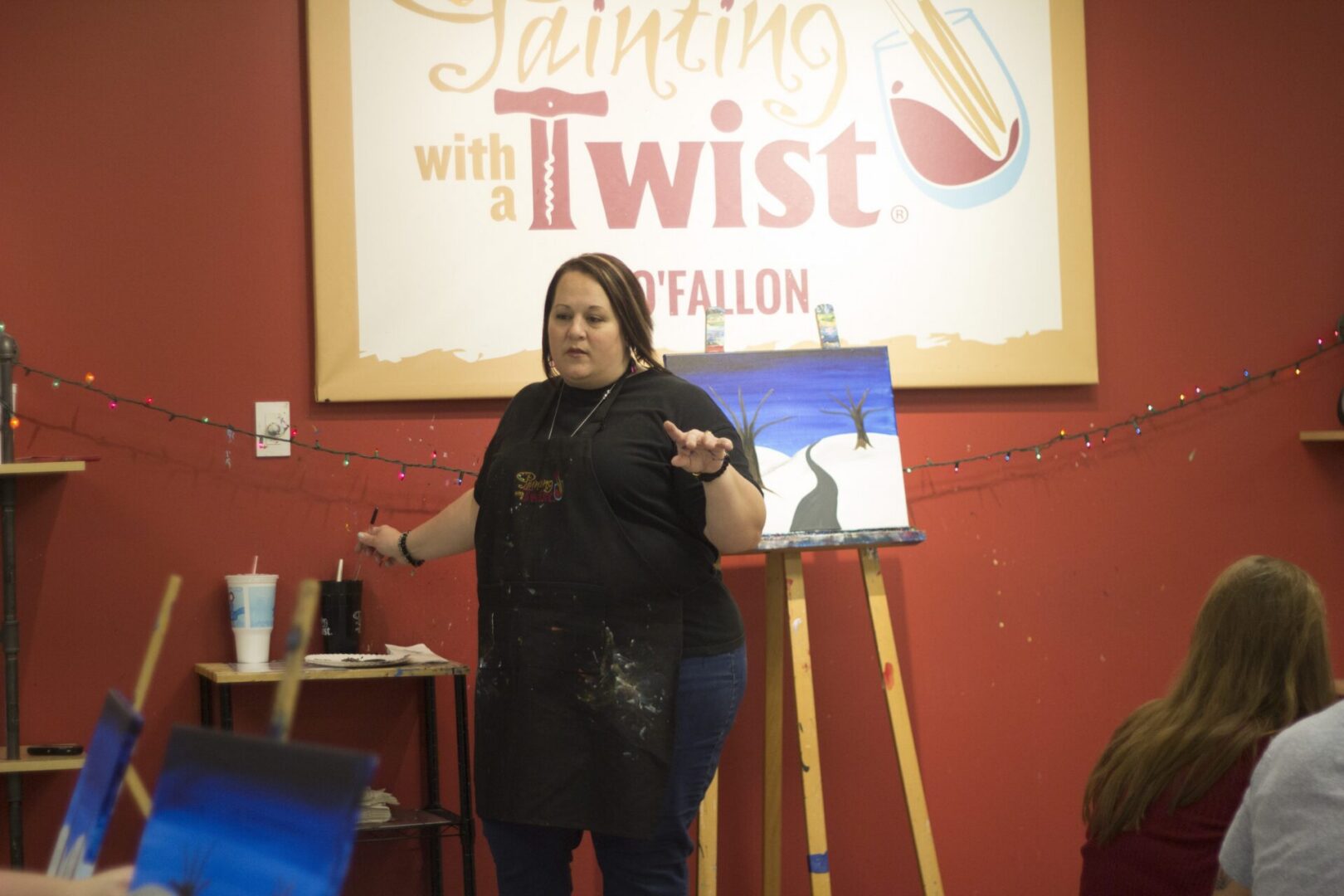 Painting instructor giving a demonstration