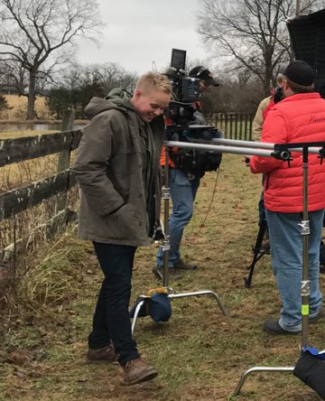 Film crew setting up outdoor scene
