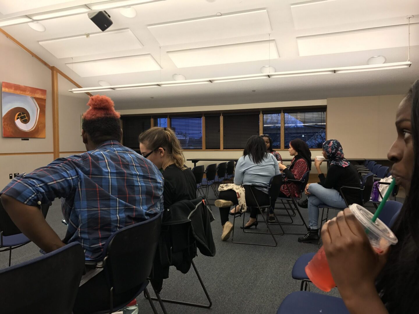 People sitting in a classroom setting