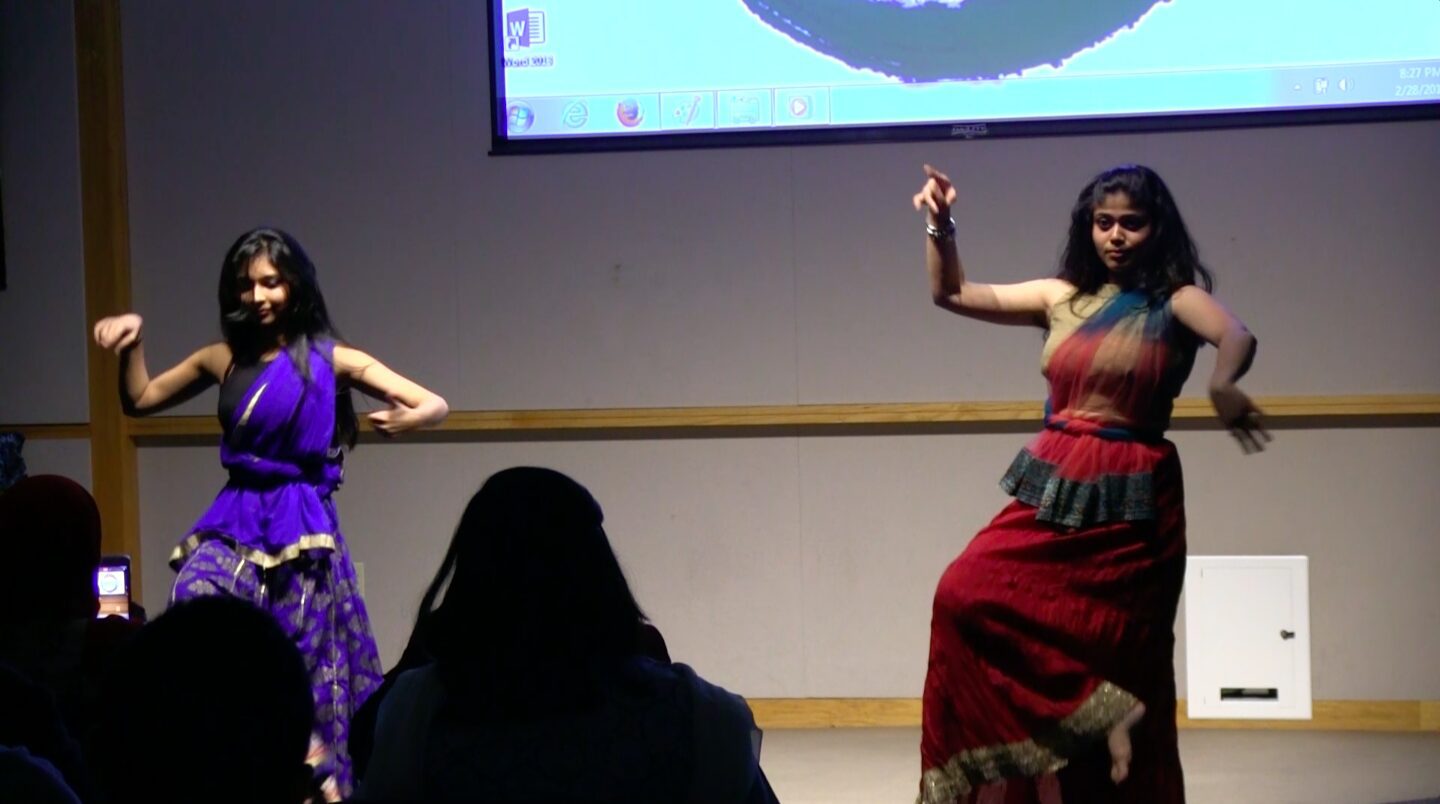 Traditional dance performance with vibrant costumes