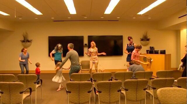 Group enjoying dance in meeting space