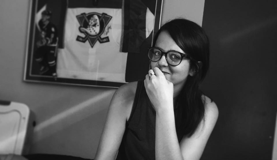 Person with glasses in black and white