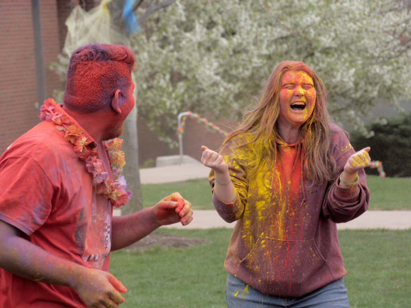 Friends enjoying Holi festival with colors