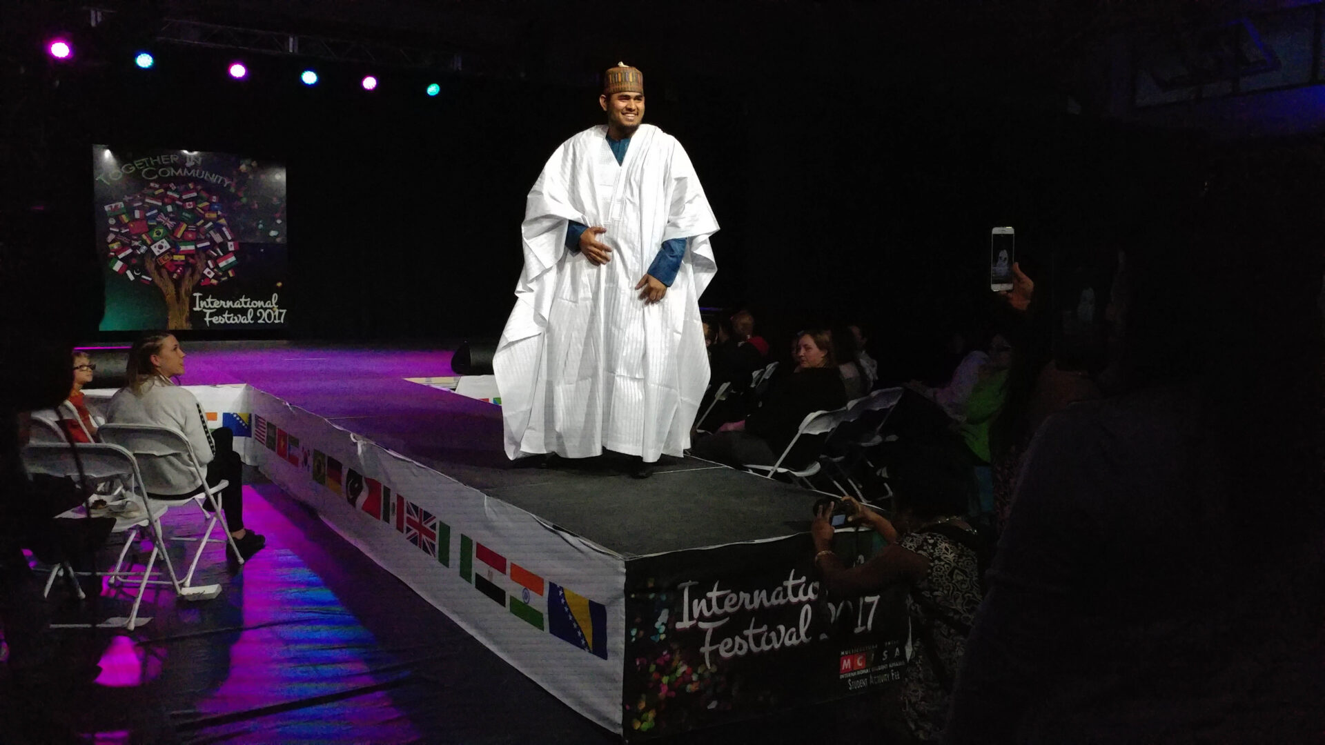 Model on stage at festival