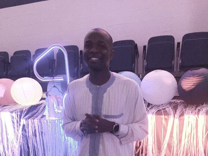 Man smiling at decorated event