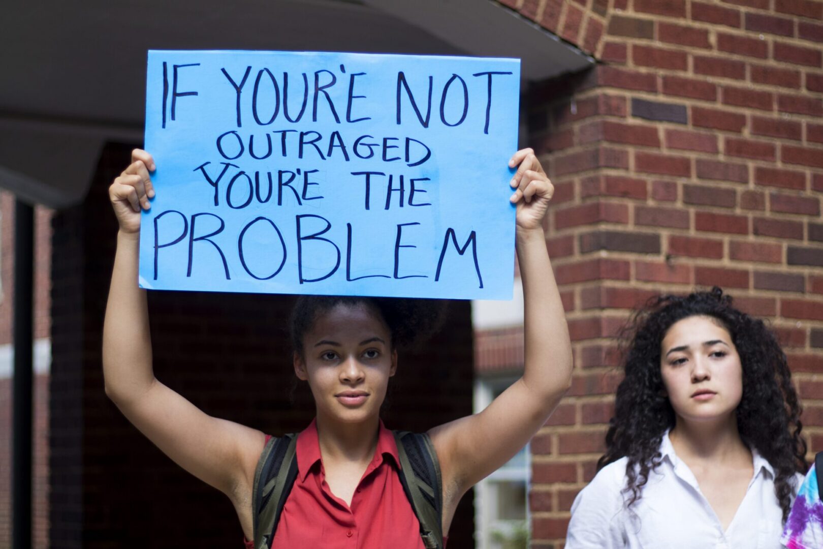 Protest sign about outrage