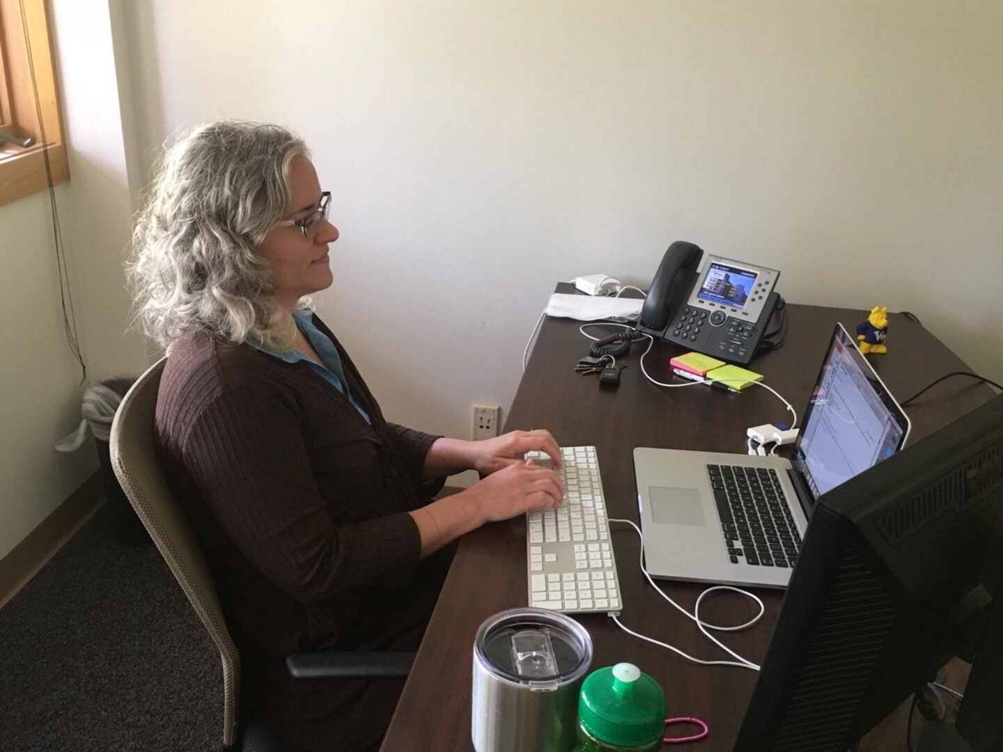 Person using computer in office setting