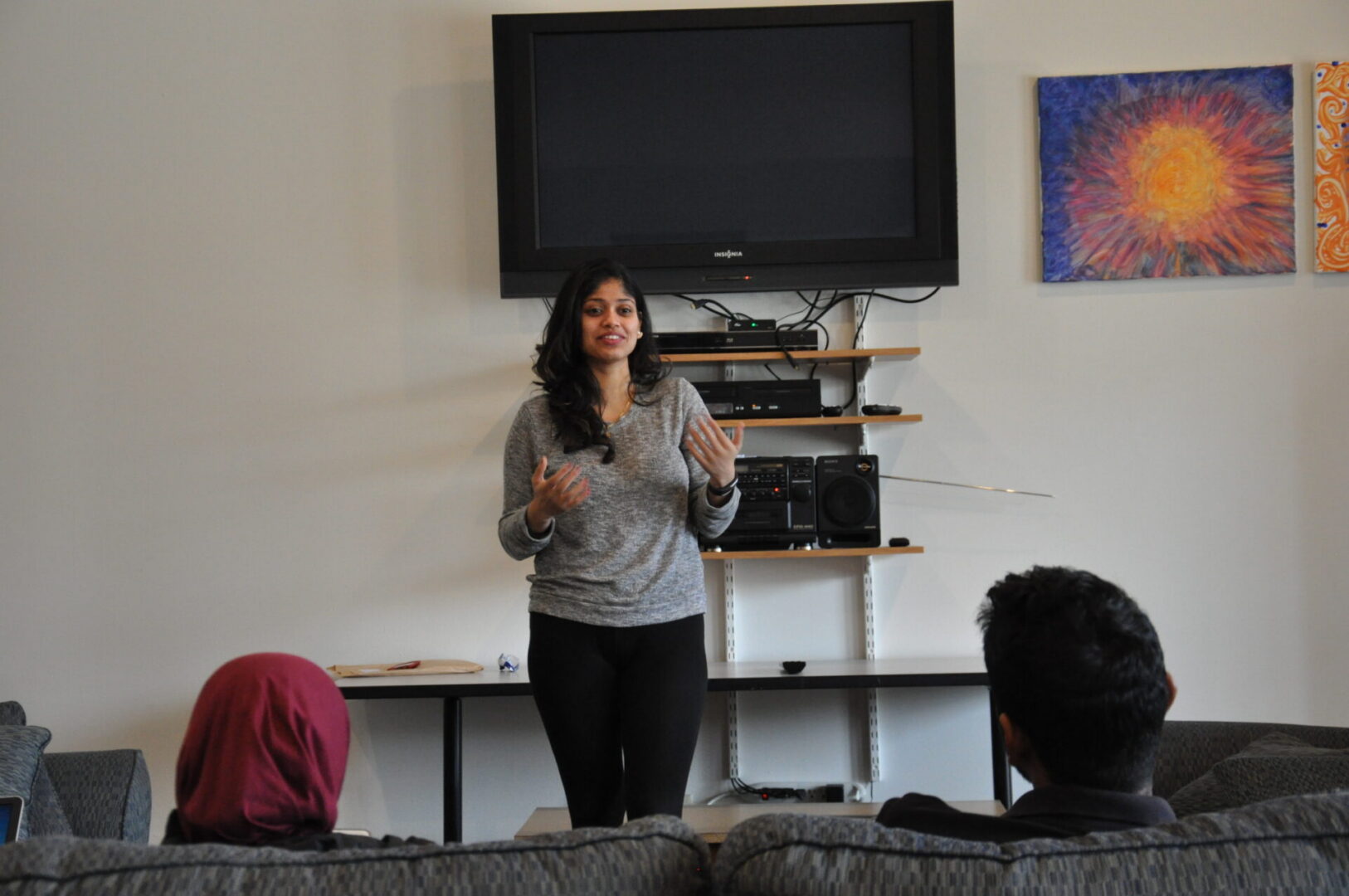 Woman giving presentation in living room