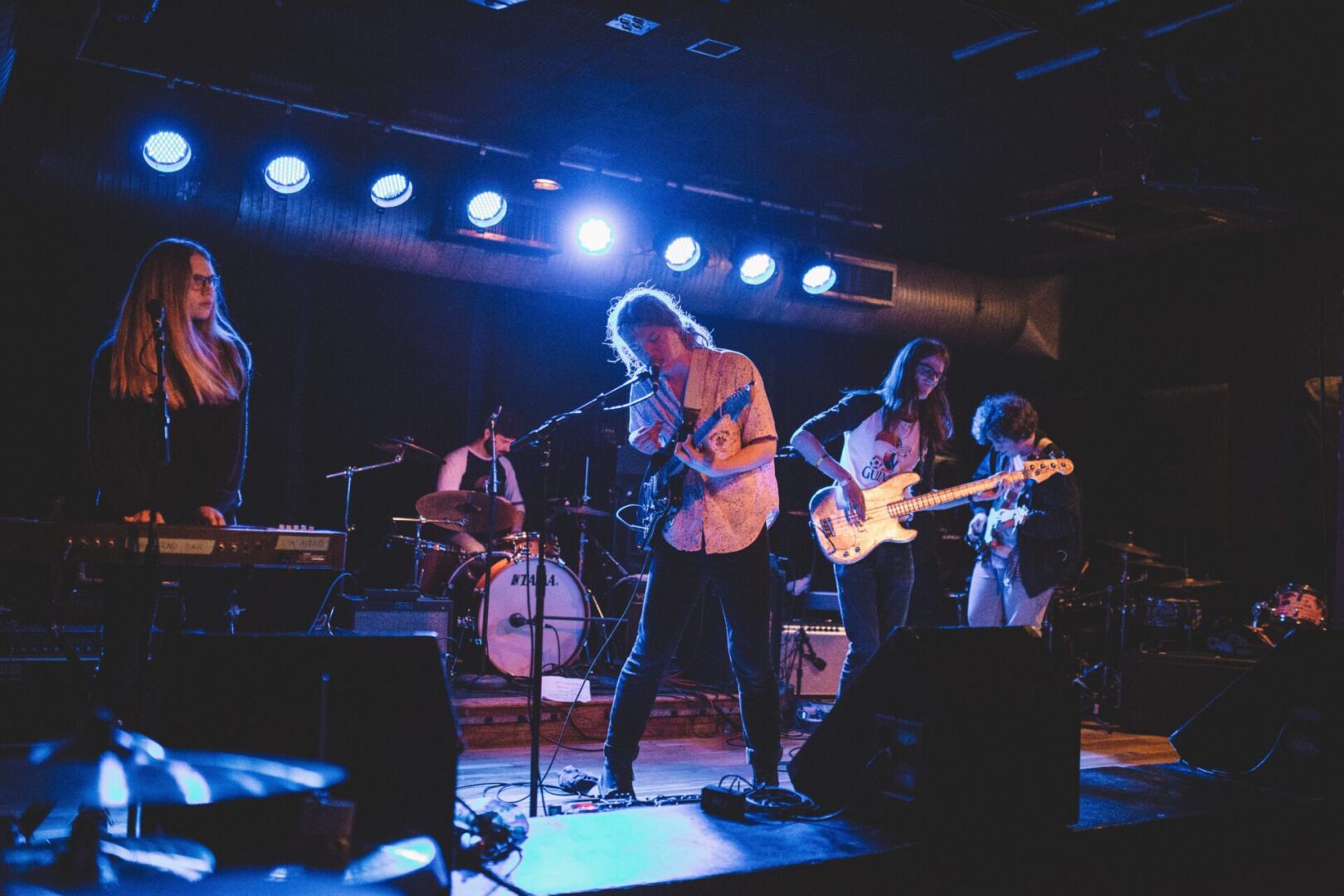 Concert with band members on stage