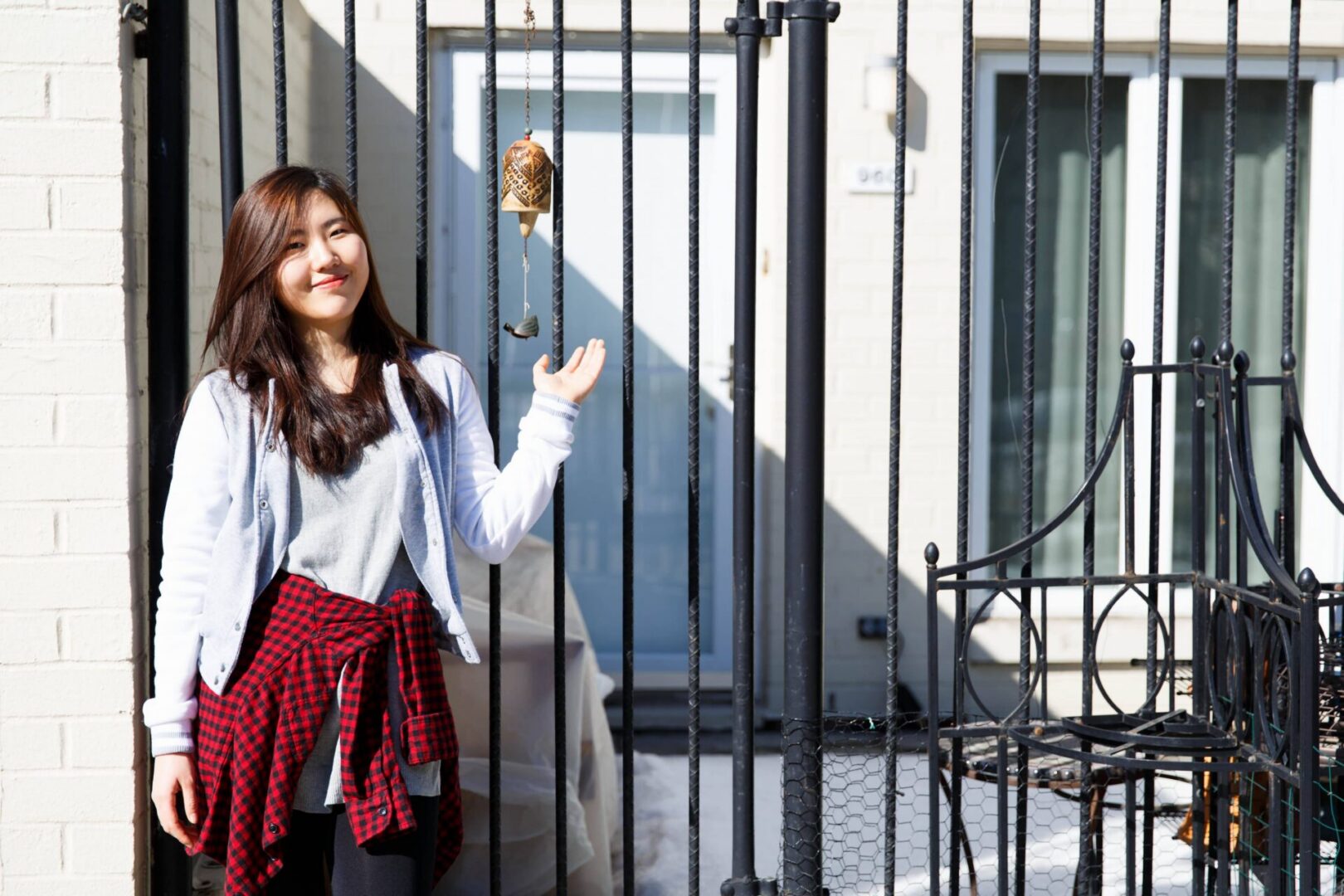 Woman with red plaid shirt outside