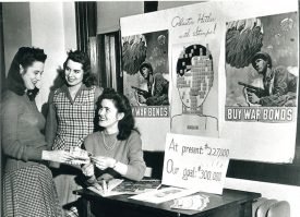 Photo Credit: Webster University Webster students sell war bonds during World War II on campus. 