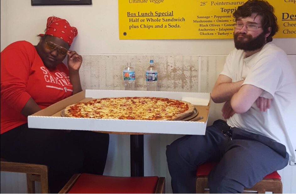 Dining with an oversized pizza box