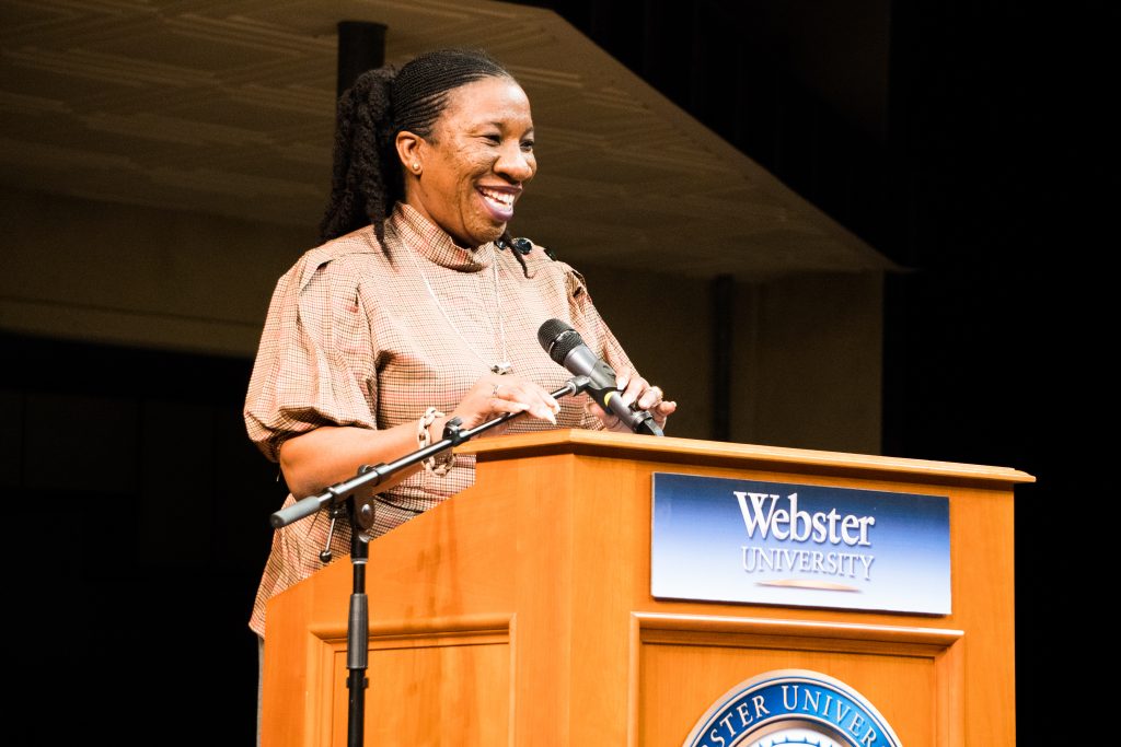 Tarana Burke smiles into the audience gathered in the Loretto-Hilton Center before addressing the crowd.