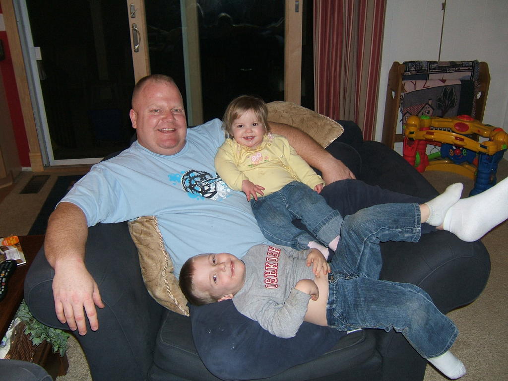Family relaxing on a cozy chair