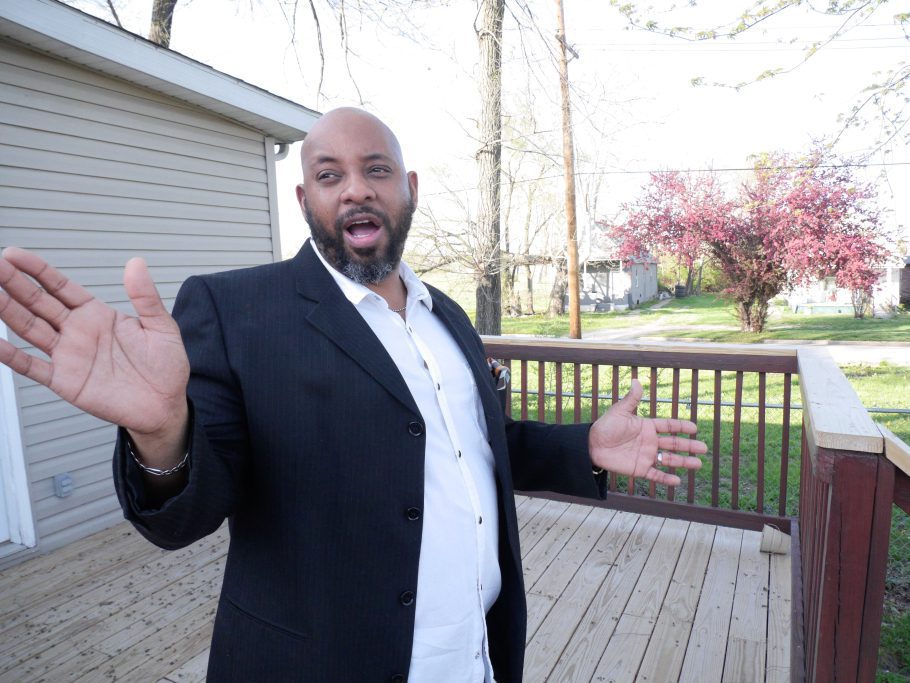 Man gesturing on wooden deck