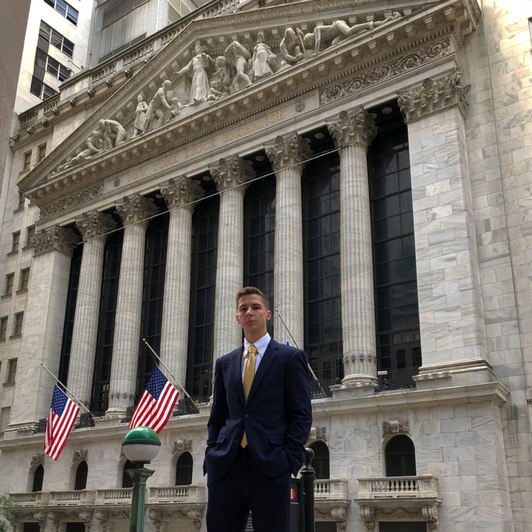 Businessman in front of stock exchange