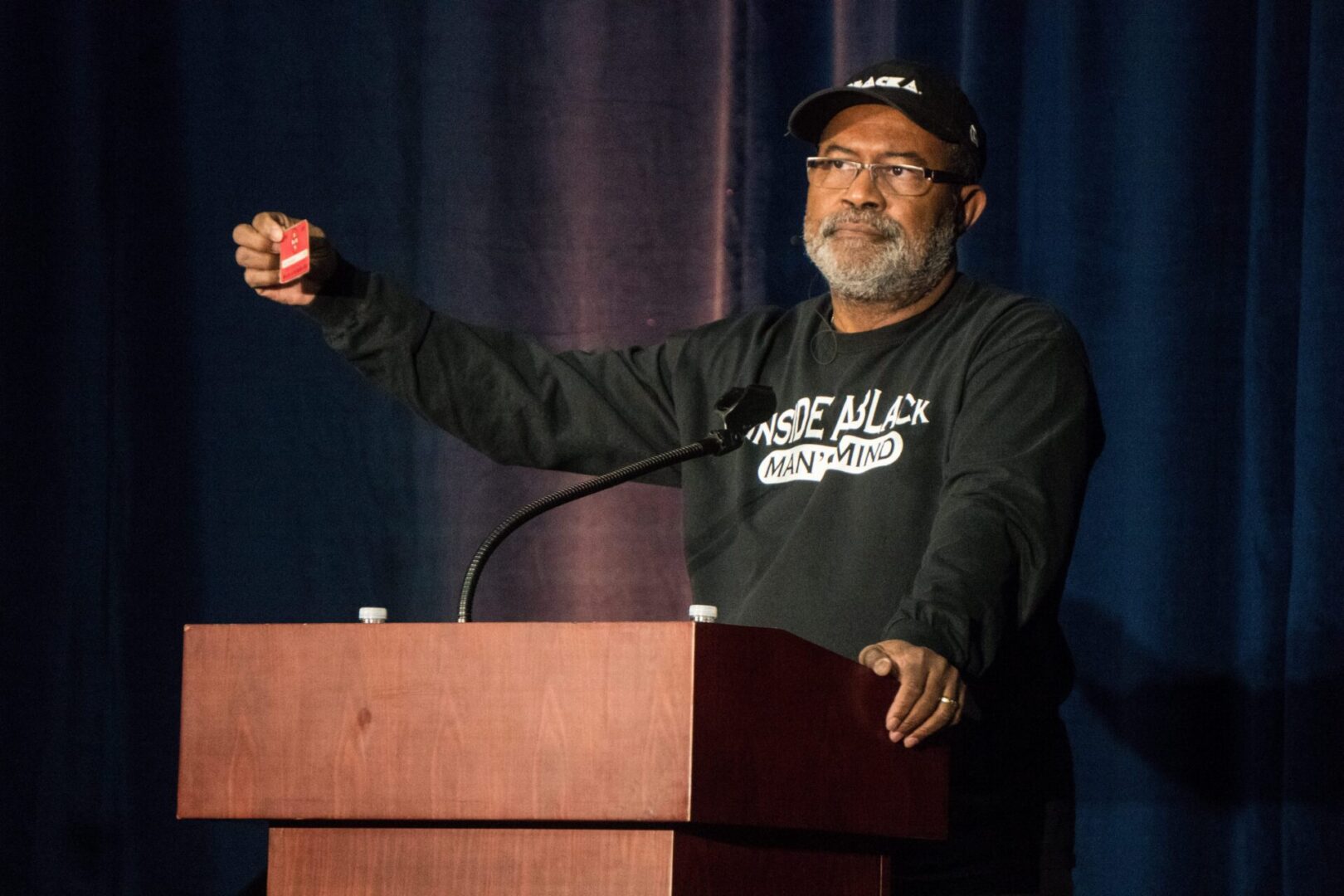 Man speaking at a podium