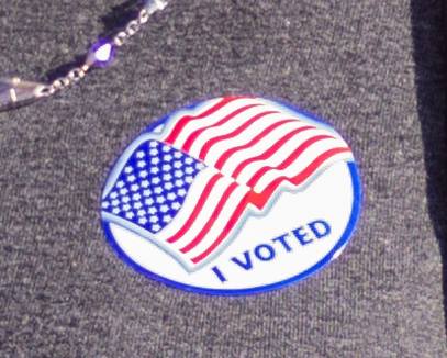 Patriotic sticker with American flag design.