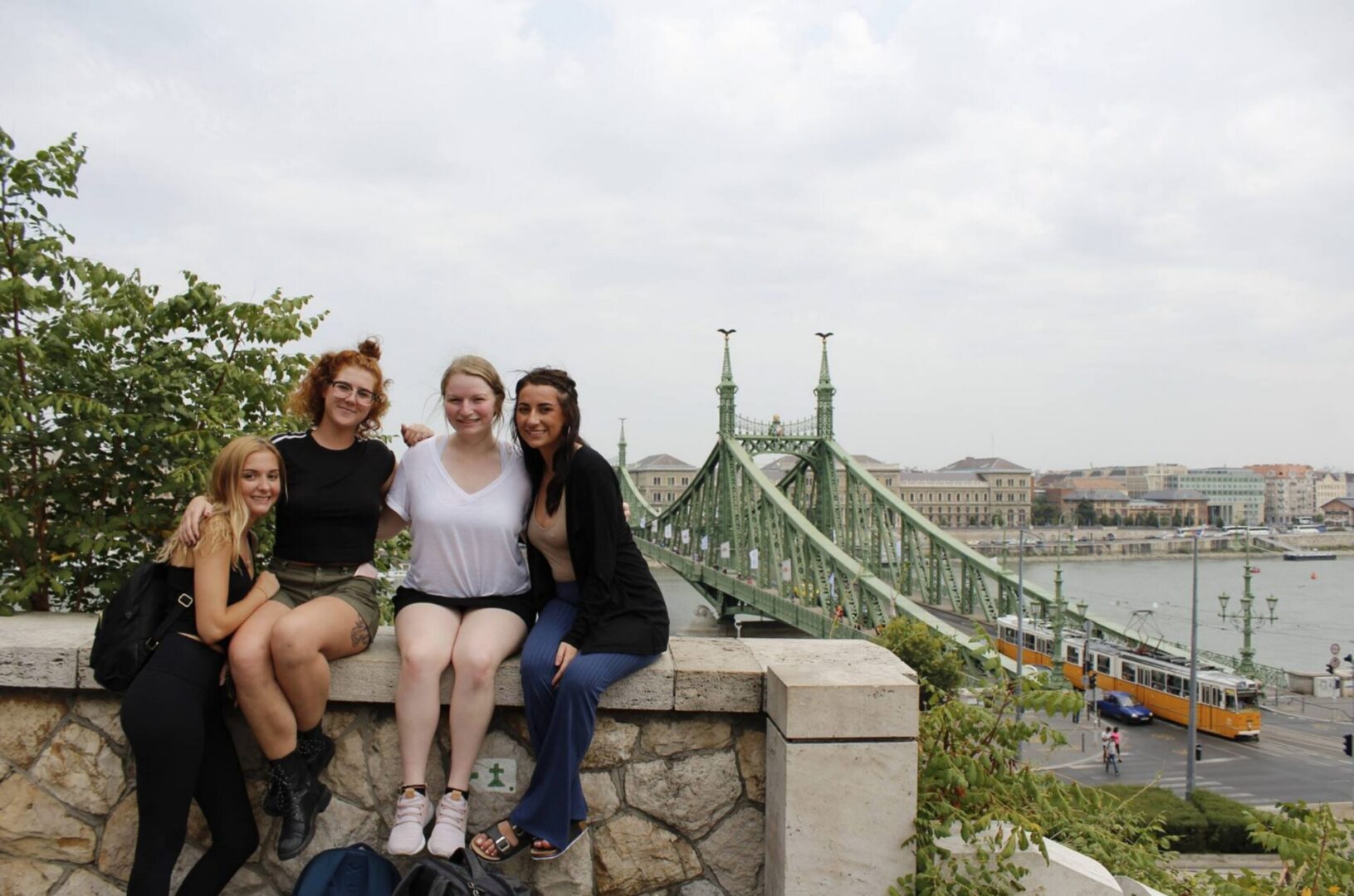 Smiling friends with cityscape backdrop