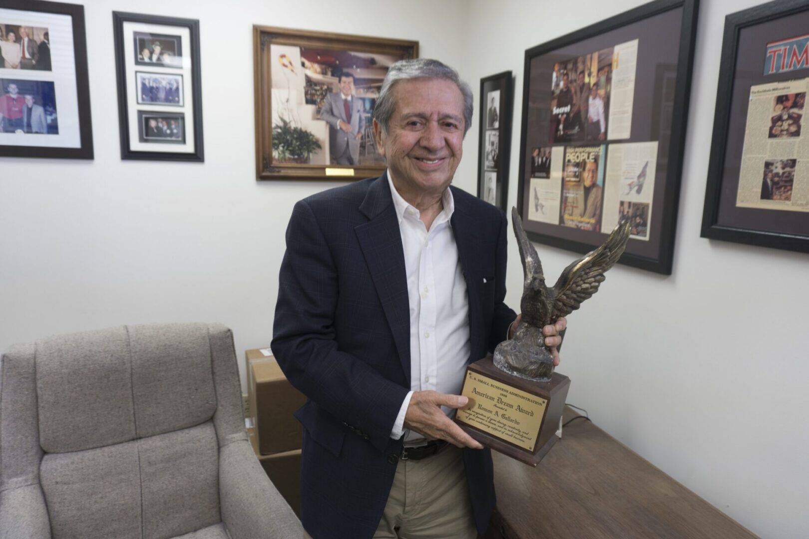Man holding an eagle trophy