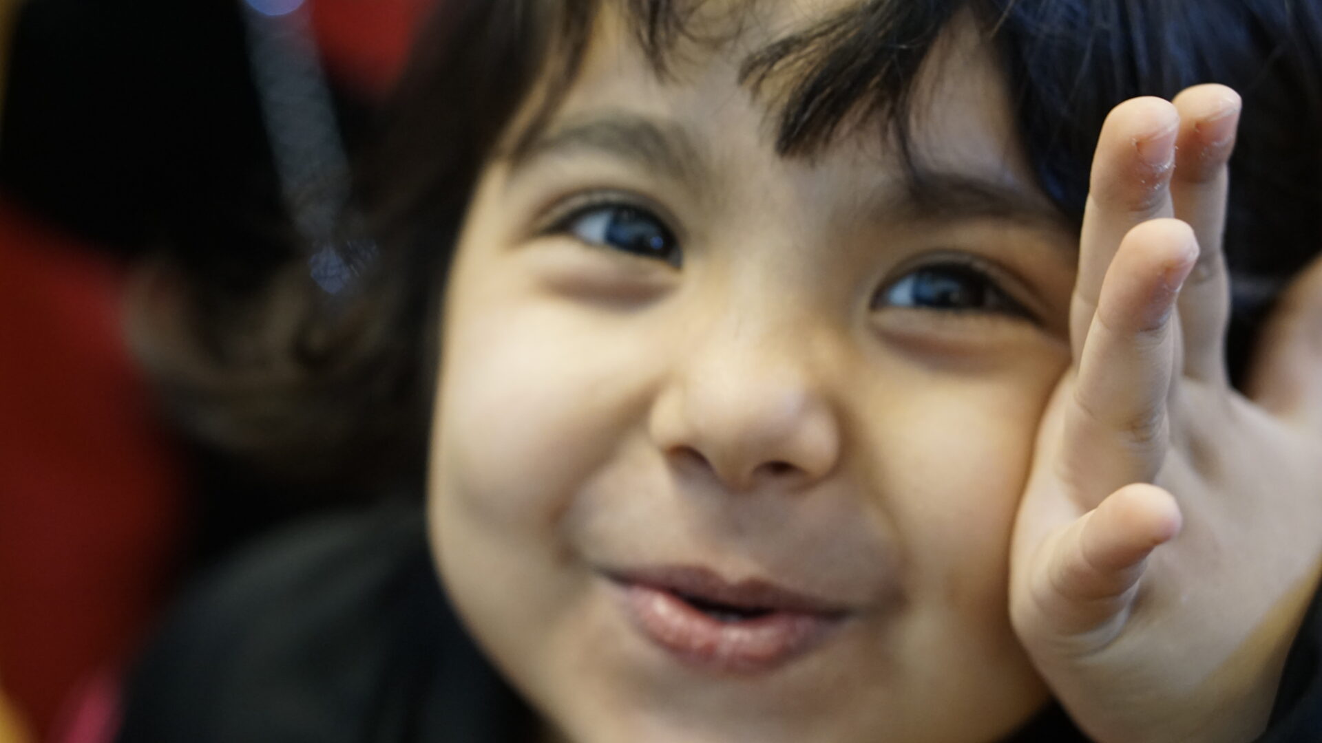 Cheerful kid playfully posing