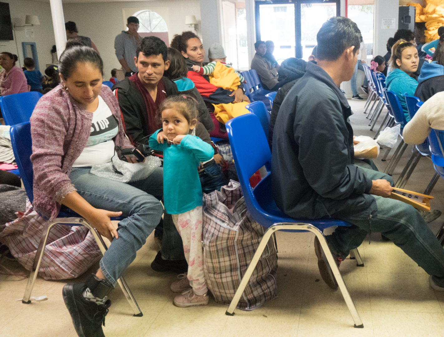 Family seated in community center