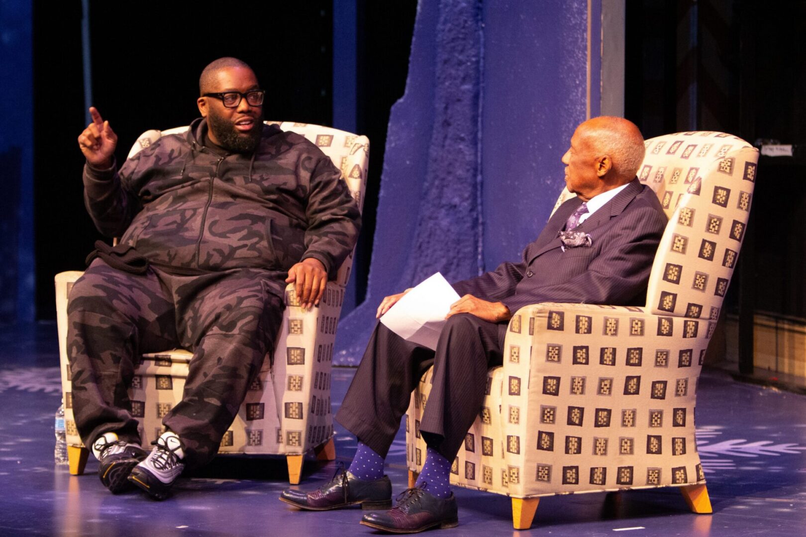 Engaging dialogue between two men on stage