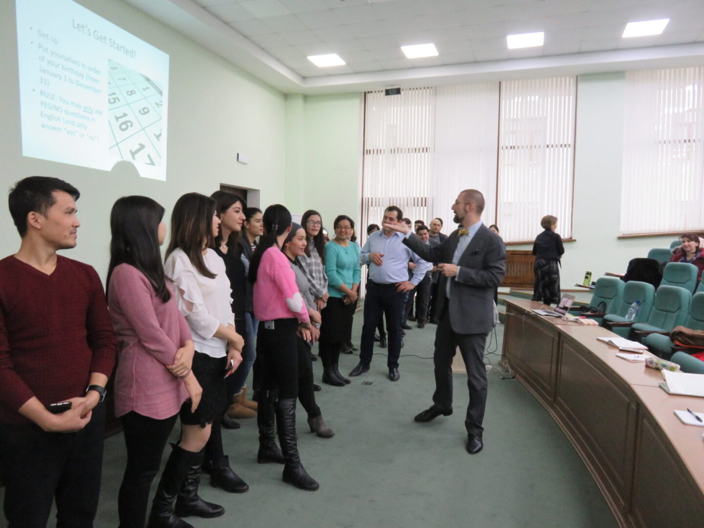 Colleagues standing in a conference room