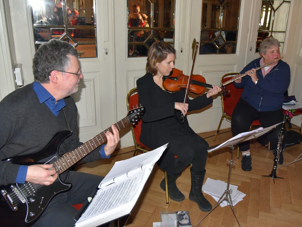 Group of musicians in a rehearsal setting