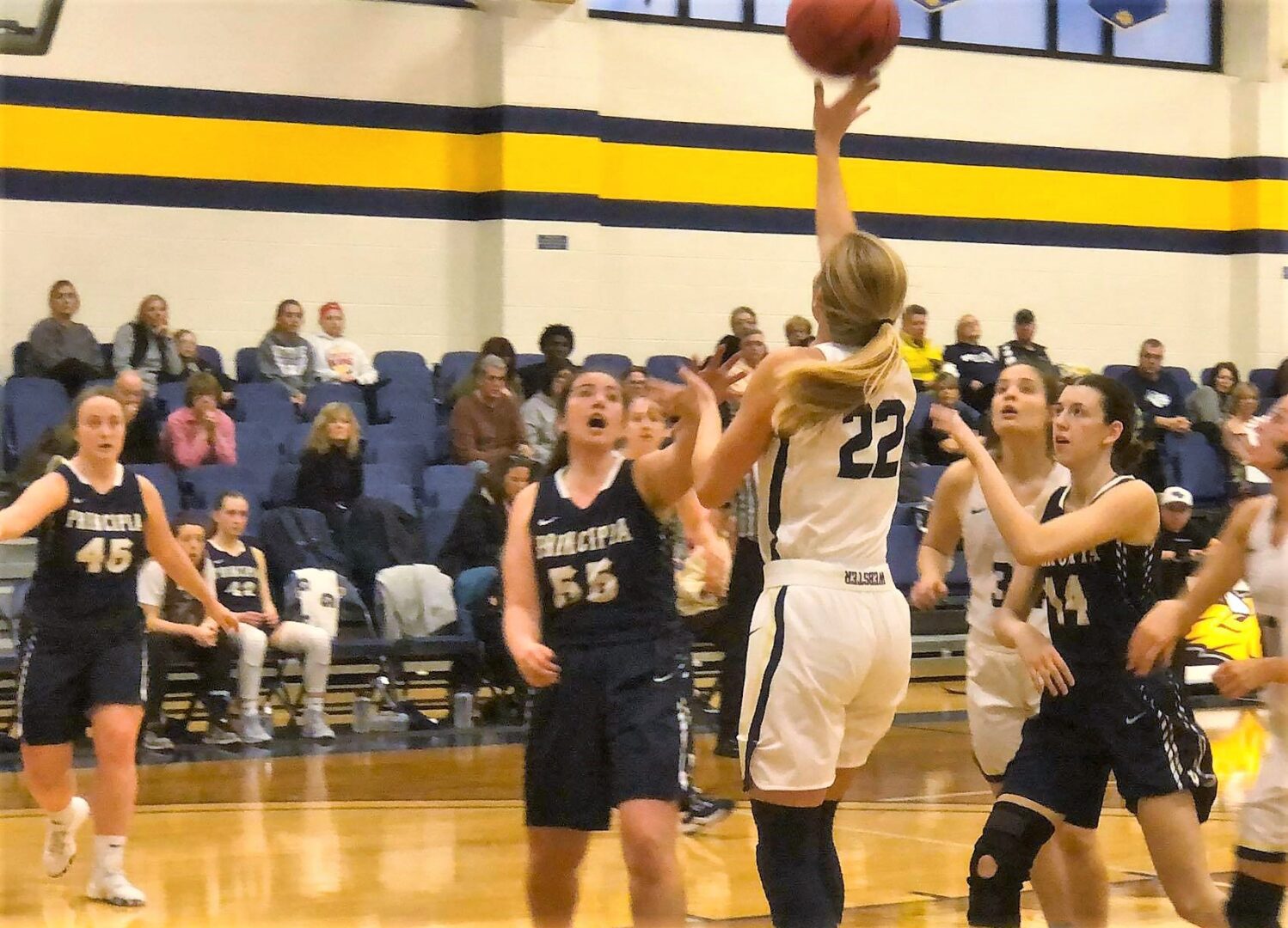 Athlete taking jump shot in competition