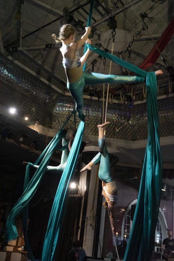 Acrobats suspended in mid-air performance