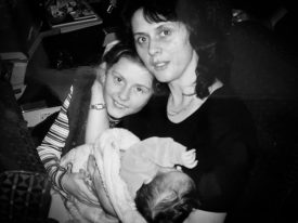 Family cuddling in vintage photograph