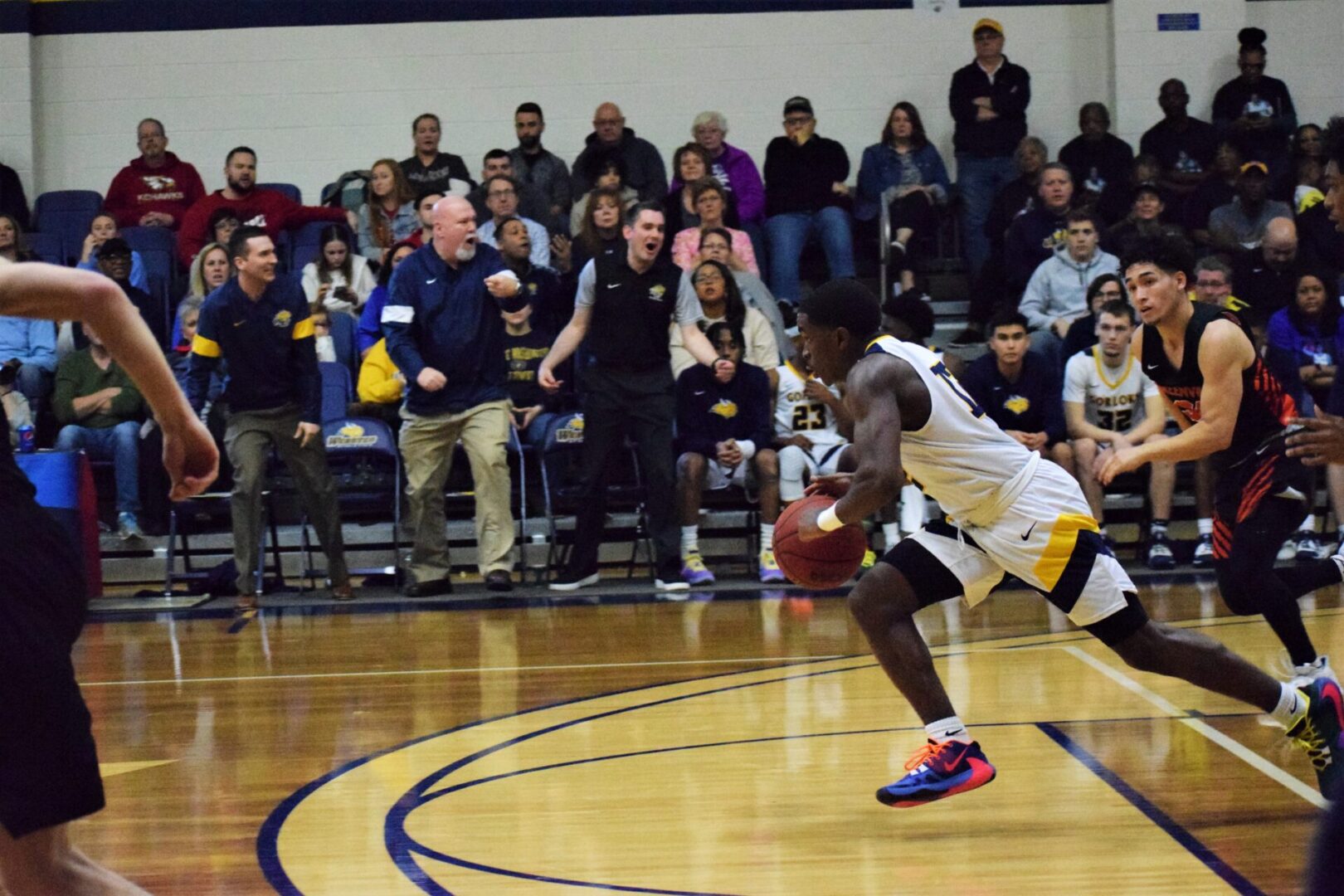 Athlete drives ball on court