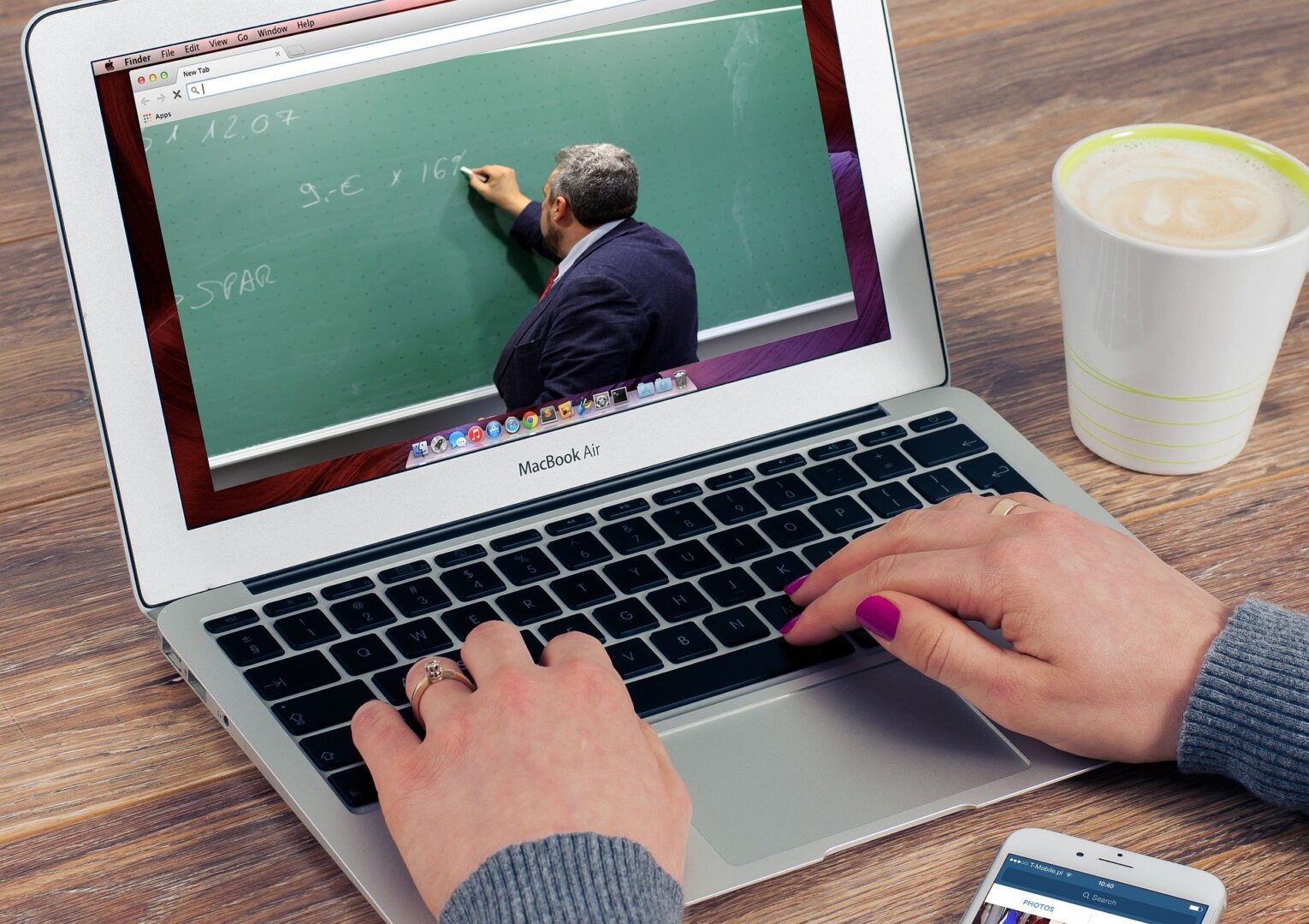 Person watching educational video on laptop