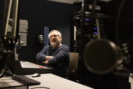 Jim Singer sits in the studio