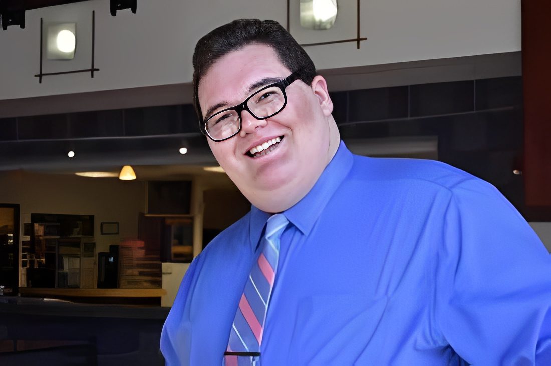 Happy individual at an indoor setting