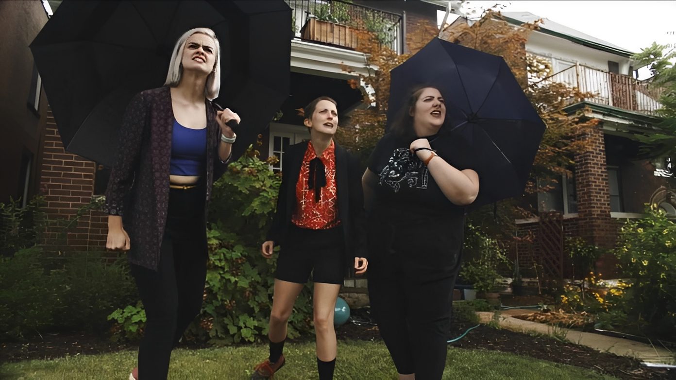 Group of women with black umbrellas