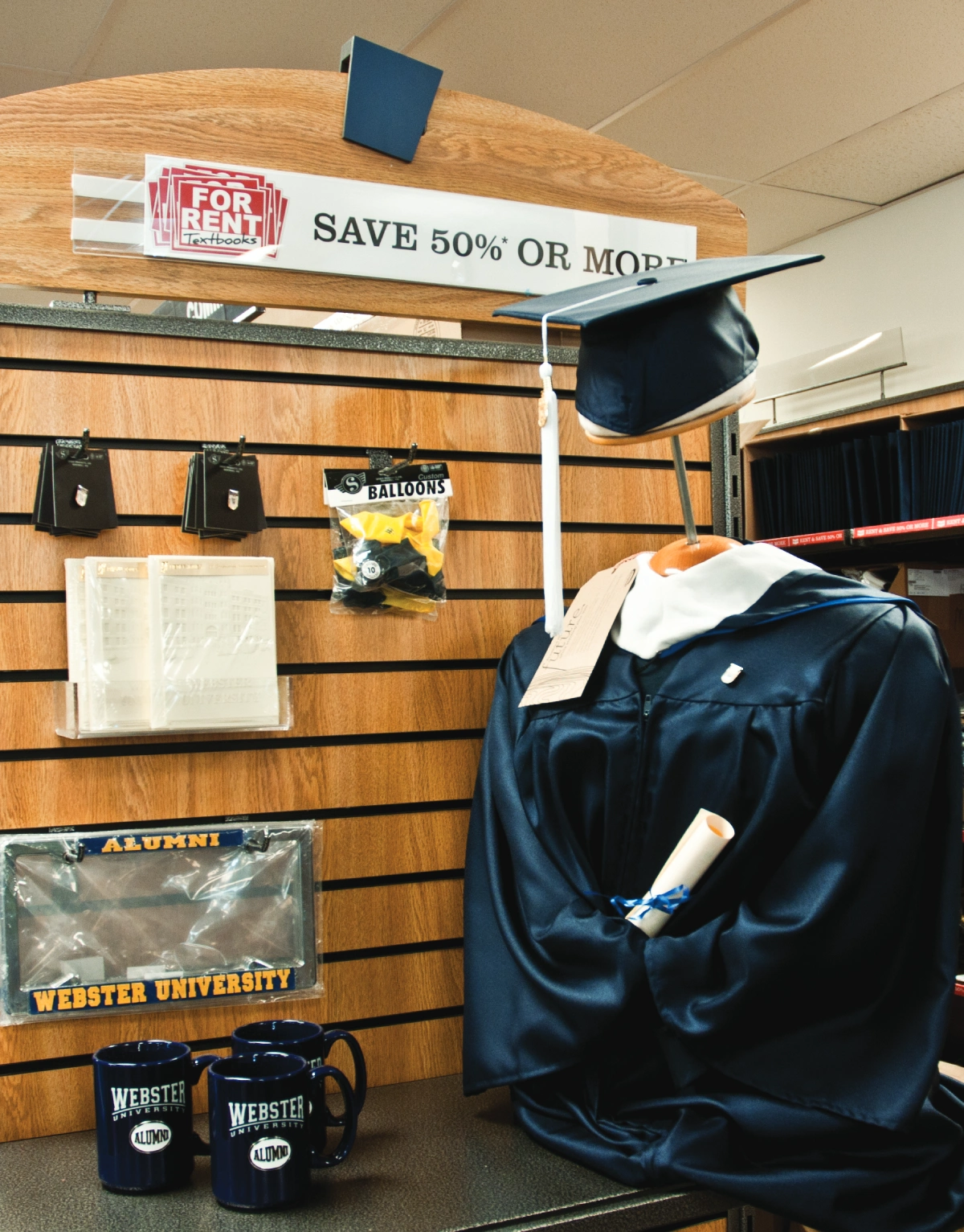 Graduation gown and cap on display