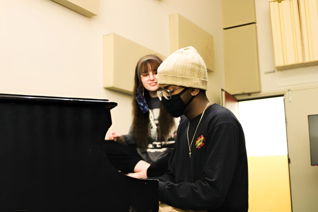 Musician playing piano in studio