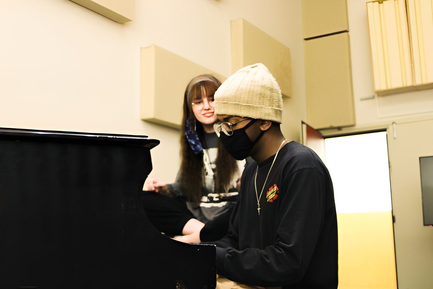 Musician playing piano in studio