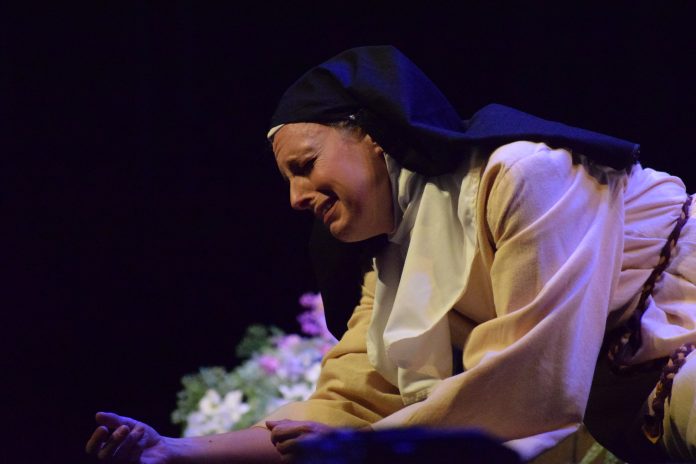 Nun in emotional stage performance