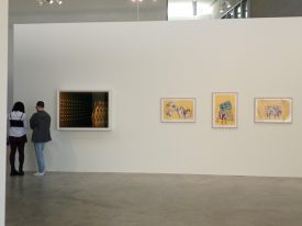 People observing art in a gallery