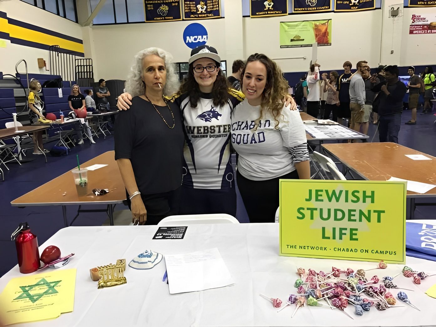 Students at campus event table