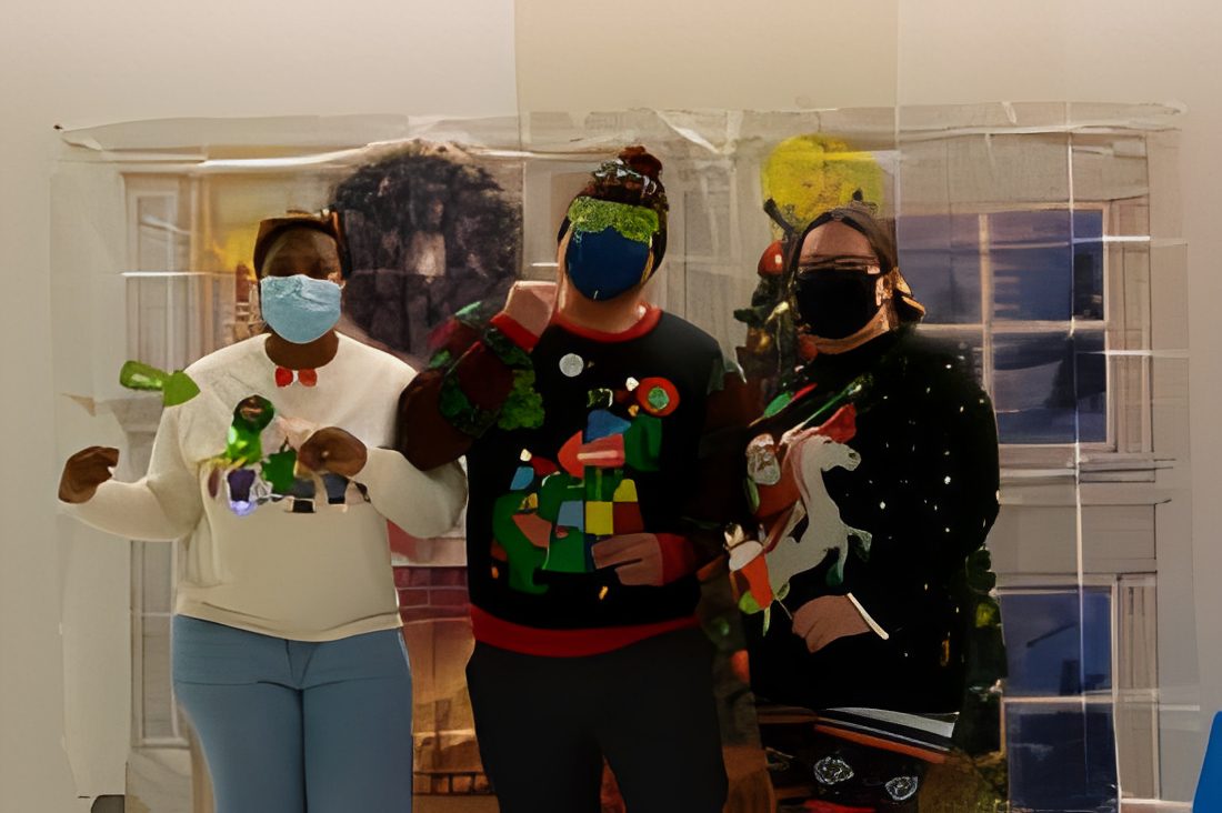 Three people in holiday sweaters