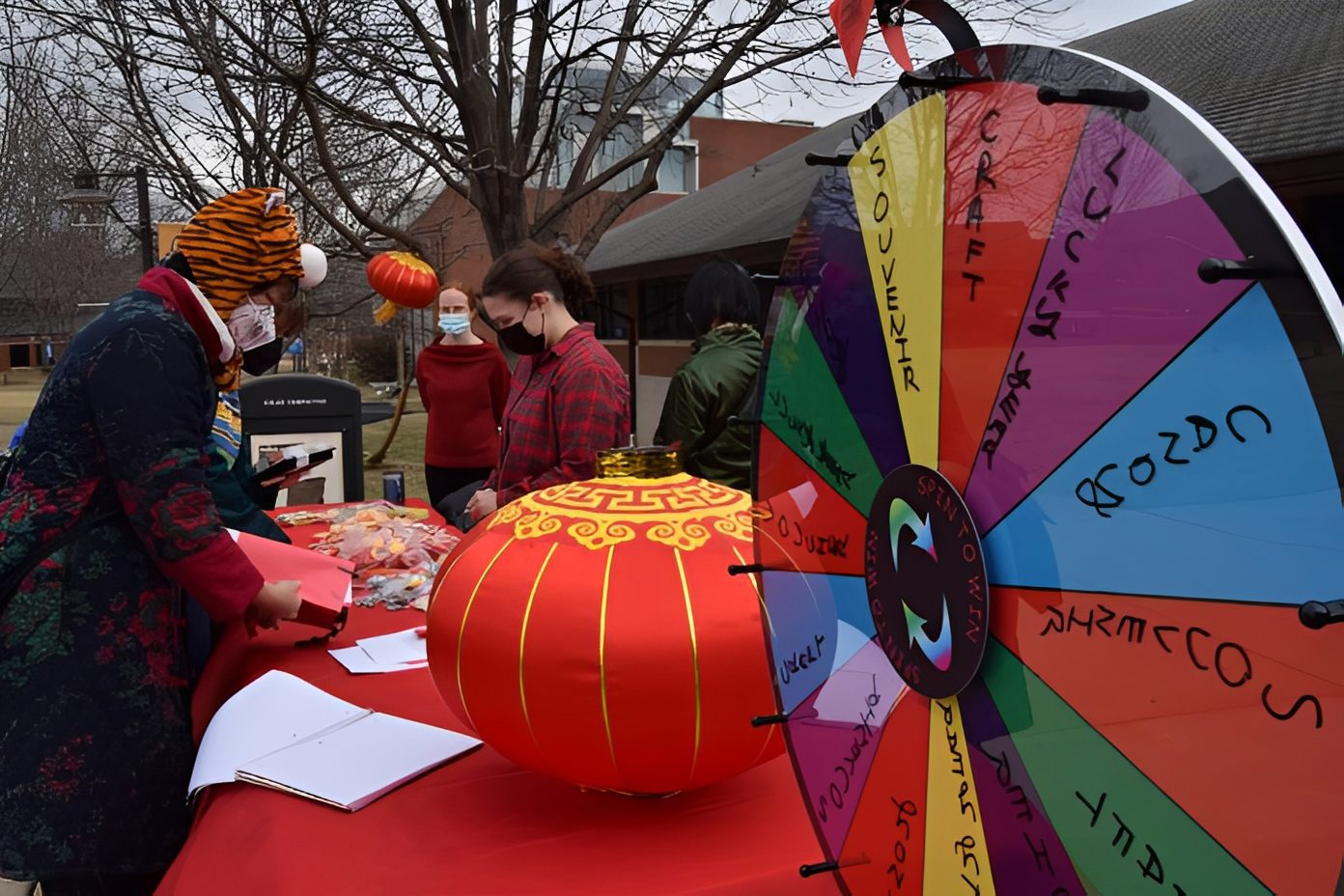Festive outdoor event with prize wheel